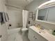 Clean bathroom with shower-tub combination, white tile, and modern vanity offers a fresh and inviting space at 5474 S Maryland Pkwy, Las Vegas, NV 89119