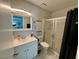 Well-lit bathroom featuring a modern vanity, tiled shower, and contemporary fixtures at 5474 S Maryland Pkwy, Las Vegas, NV 89119