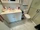 Clean bathroom featuring a white vanity with storage, and a shower with glass doors at 5474 S Maryland Pkwy, Las Vegas, NV 89119