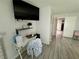 Bedroom shows a work desk and access to an adjacent room with sleek, light-colored flooring at 5474 S Maryland Pkwy, Las Vegas, NV 89119