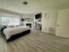 Bright bedroom features a cozy fireplace, a mounted television, and modern decor at 5474 S Maryland Pkwy, Las Vegas, NV 89119