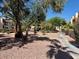 Beautifully maintained community courtyard with mature trees, shrubs and walking paths at 5474 S Maryland Pkwy, Las Vegas, NV 89119