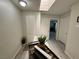 Light filled hallway with skylight, decorative planter and access to other rooms at 5474 S Maryland Pkwy, Las Vegas, NV 89119