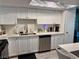 Open kitchen featuring white cabinets, stainless steel appliances and stone countertops at 5474 S Maryland Pkwy, Las Vegas, NV 89119