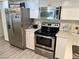 Kitchen featuring stainless steel appliances, white countertops and ample storage at 5474 S Maryland Pkwy, Las Vegas, NV 89119