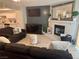Comfortable living room featuring a fireplace, modern decor, and a view of the kitchen at 5474 S Maryland Pkwy, Las Vegas, NV 89119