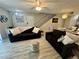 Cozy living room showcasing seating, lighting and stair access at 5474 S Maryland Pkwy, Las Vegas, NV 89119