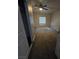 Neutral bedroom with ceiling fan and large window provides ample light at 5615 Blue Sea St, Las Vegas, NV 89110