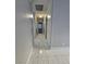 Neutral hallway offers smooth walls, tile flooring, and recessed lighting at 5615 Blue Sea St, Las Vegas, NV 89110