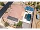 A high-angle view showing a pool, hot tub, sports court, solar panels, and patio area at 5812 Shangri La Night Ct, Las Vegas, NV 89149