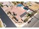 Aerial view of a home with a sport court, pool, patio, solar panels, and a landscaped perimeter at 5812 Shangri La Night Ct, Las Vegas, NV 89149