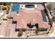 Expansive home featuring a pool, sport court, solar panels, and a large circular driveway at 5812 Shangri La Night Ct, Las Vegas, NV 89149