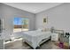 Bright bedroom with a large window, light walls, and a comfortable bed with plush pillows at 5812 Shangri La Night Ct, Las Vegas, NV 89149