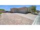 Wide brick driveway leading to a three-car garage, complemented by desert landscaping and gated entrance at 5812 Shangri La Night Ct, Las Vegas, NV 89149