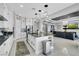 Modern kitchen featuring white cabinets, stainless steel appliances, and an island with pendant lighting at 5812 Shangri La Night Ct, Las Vegas, NV 89149