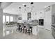 Bright kitchen with white cabinetry, stainless steel appliances, and a center island with seating at 5812 Shangri La Night Ct, Las Vegas, NV 89149