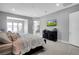 Airy main bedroom featuring lots of tile, a large bed, contemporary decor, and lots of light at 5812 Shangri La Night Ct, Las Vegas, NV 89149