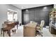 Office space with a grand piano, desk, and a wall with dark wood paneling at 5812 Shangri La Night Ct, Las Vegas, NV 89149