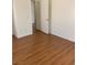 Bedroom featuring neutral-colored walls and laminate flooring at 6470 Shining Sand Ave, Las Vegas, NV 89142