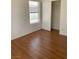 Bright bedroom featuring laminate flooring, natural light and a closet at 6470 Shining Sand Ave, Las Vegas, NV 89142