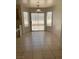 Bright dining area featuring a sliding door and large windows at 6470 Shining Sand Ave, Las Vegas, NV 89142