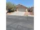 Cozy single-story home featuring a two-car garage and desert landscaping at 6470 Shining Sand Ave, Las Vegas, NV 89142