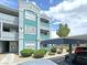 Well-kept apartment building exterior featuring assigned covered parking and landscaping at 6955 N Durango Dr # 1022, Las Vegas, NV 89149