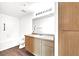 Bathroom boasts wood cabinets, laminate counters, a soaking tub and a shower at 6955 N Durango Dr # 1022, Las Vegas, NV 89149