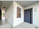 Apartment entrance featuring a dark door, modern lighting, and a hallway view at 6955 N Durango Dr # 1022, Las Vegas, NV 89149