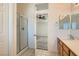 En-suite bathroom featuring a glass shower and a view into the bedroom at 697 Gull Point Ave, Las Vegas, NV 89123