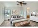 Serene main bedroom featuring neutral tones, plantation shutters, and stylish decor at 697 Gull Point Ave, Las Vegas, NV 89123