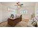 Home office with a large desk, comfortable seating, and plenty of natural light at 697 Gull Point Ave, Las Vegas, NV 89123