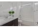 Bright bathroom featuring a sleek vanity, modern fixtures, and a pristine white shower-tub combo at 701 Webber Park St, Henderson, NV 89011