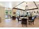 Community dining area featuring round tables, stylish chairs, and modern light fixtures at 701 Webber Park St, Henderson, NV 89011