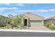 Charming single story home with a desert landscaped front yard and a brick paved driveway at 701 Webber Park St, Henderson, NV 89011