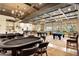 Recreation room featuring poker and billiard tables, elegant lighting fixtures, and decorative design at 701 Webber Park St, Henderson, NV 89011