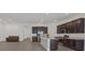 A modern kitchen with stainless appliances overlooks an open-concept living area at 701 Webber Park St, Henderson, NV 89011