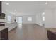 Open-concept living area boasts sleek tile flooring and abundant natural light from many windows at 701 Webber Park St, Henderson, NV 89011
