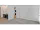 Bedroom with light gray carpet, white walls, and access to the en suite bathroom at 701 Webber Park St, Henderson, NV 89011