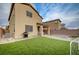 Expansive backyard with artificial turf, paver patio, and room to entertain outdoors at 7109 Red Gulch St, North Las Vegas, NV 89084