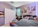 This bedroom features playful decor, a comfortable bed, and plenty of closet space, making it ideal for storage at 7109 Red Gulch St, North Las Vegas, NV 89084