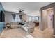 Cozy living room with plush seating, ceiling fan, and modern décor at 7109 Red Gulch St, North Las Vegas, NV 89084
