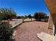 View of the desert landscape beyond the decorative backyard privacy fence at 7273 Vista Bonita Dr, Las Vegas, NV 89149