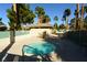 Relaxing hot tub with a view of tables and chairs, perfect for enjoying the outdoors with mature trees at 7273 Vista Bonita Dr, Las Vegas, NV 89149