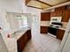 Kitchen with light countertops and wooden cabinets, along with a full suite of appliances at 7273 Vista Bonita Dr, Las Vegas, NV 89149
