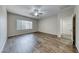 Bedroom with neutral walls, a ceiling fan, and hardwood-style flooring at 7606 Kenwood Hills Ct, Las Vegas, NV 89131