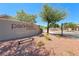 Parkfield at Silver Stone Ranch community entrance featuring sign, landscaping, and street view at 7606 Kenwood Hills Ct, Las Vegas, NV 89131