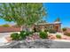 Charming single-story home featuring a landscaped front yard, desert foliage, and a stone-accented entryway at 7606 Kenwood Hills Ct, Las Vegas, NV 89131