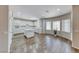 Bright kitchen with white cabinetry, an island, stainless appliances, and a breakfast bar at 7606 Kenwood Hills Ct, Las Vegas, NV 89131