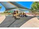 Community playground featuring a covered play structure for children at 7606 Kenwood Hills Ct, Las Vegas, NV 89131